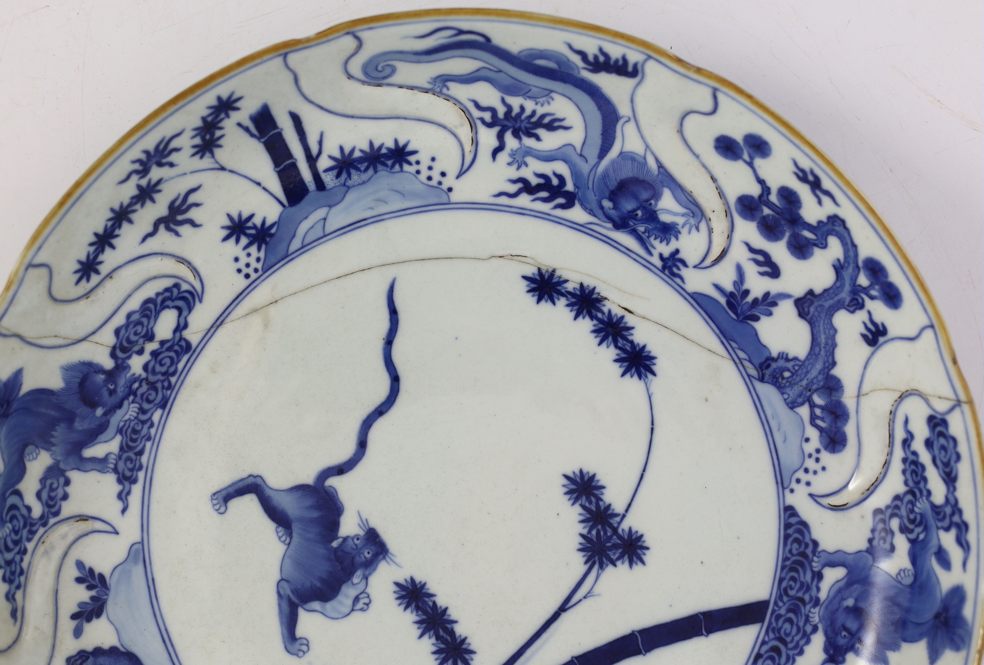 A pair of Chinese blue and white armorial dishes in Japanese Kakiemon style, Qianlong period, c.1752